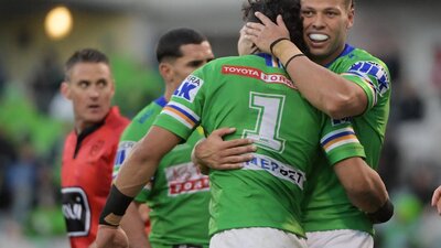 Sebastian Kris and Xavier Savage celebrate a try against the Roosters