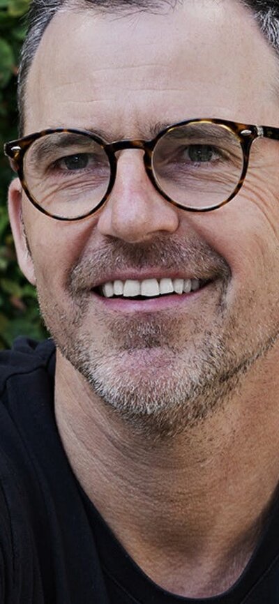 Wed 1 October: Shaun Lockyer FRAIA, Shaun Lockyer Architects (Brisbane) Coloured profile image of man wearing glasses smiling and looking past camera
