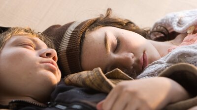 Blessed (2003) Close up of two young people's faces, lying next to each other cosied up