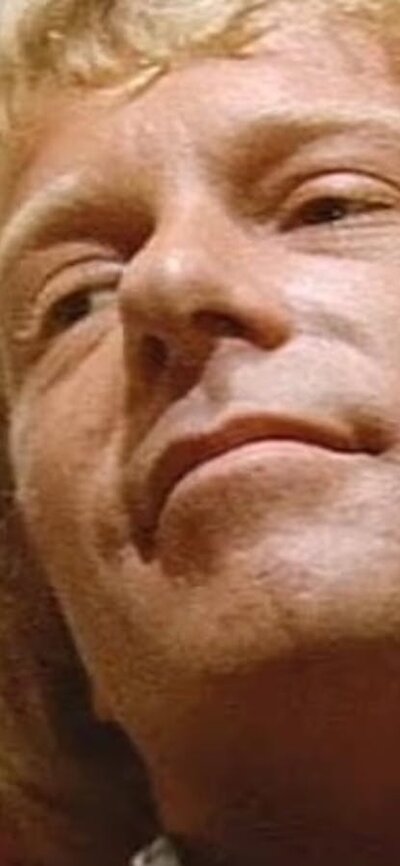 Petersen (1974) Man with blonde hair looks past the camera to the left
