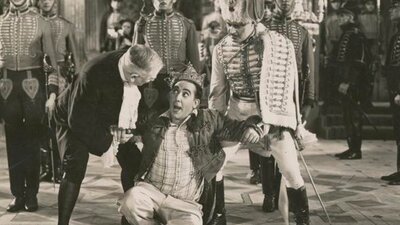 Black and white image of men dressed as royals