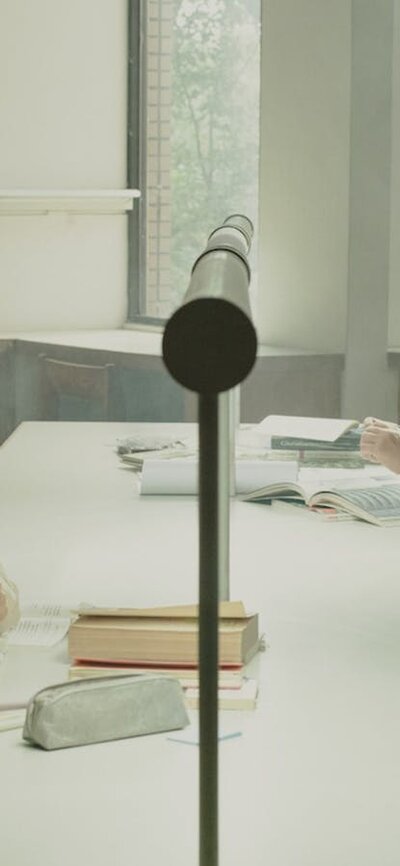 A women and a man sitting on opposite sides of the table