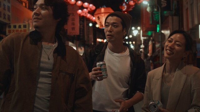 Last Night In Taipei Three people walking in the streets of Taipei
