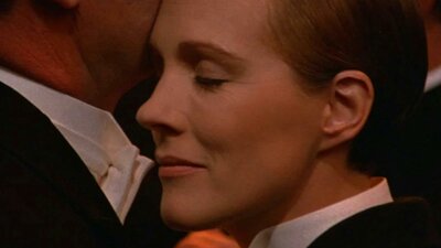 A Day at the Movies: Victor/Victoria (Dementia-Friendly) 31 October, 2026 Close up of woman dressed in tuxedo with eyes closed pressed against chin of another person