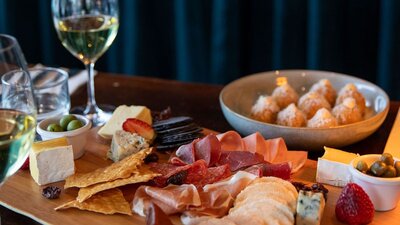 Selection of Tilba cheeses with membrillo, cornichons,  muscatels and Fedra olives