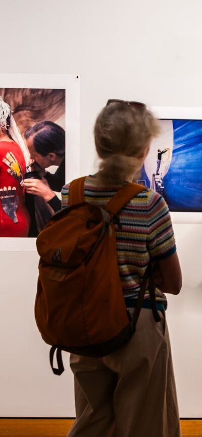 Two people exploring the exhibition A Total Work of Art: Sidney Nolan and the Stage