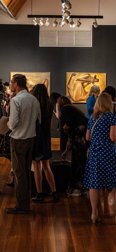 A Total Work of Art: Sidney Nolan and the Stage A group of people exploring the exhibition A Total Work of Art: Sidney Nolan and the Stage