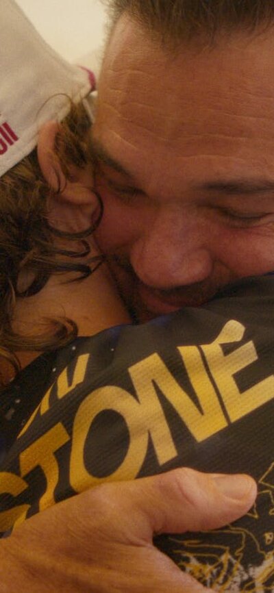 Son and father hugging