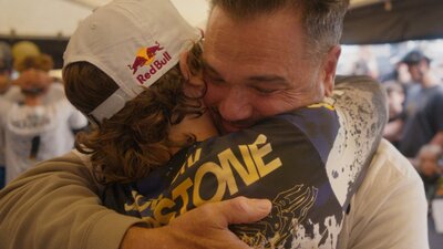Son and father hugging