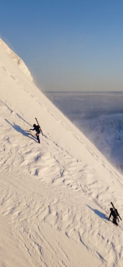 Wide shot of climbers up a snowy mountain