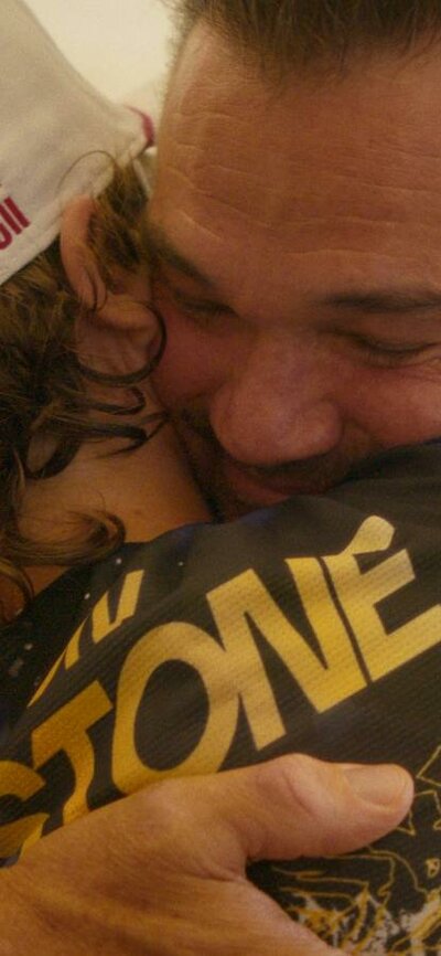 Son and father hugging
