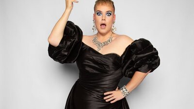 Alright Hey posing with his hand up looking shocked