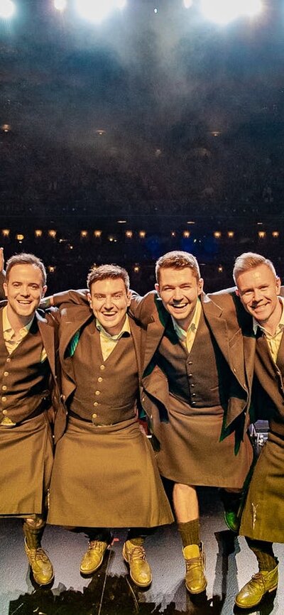 Celtic Thunder smiling on stage