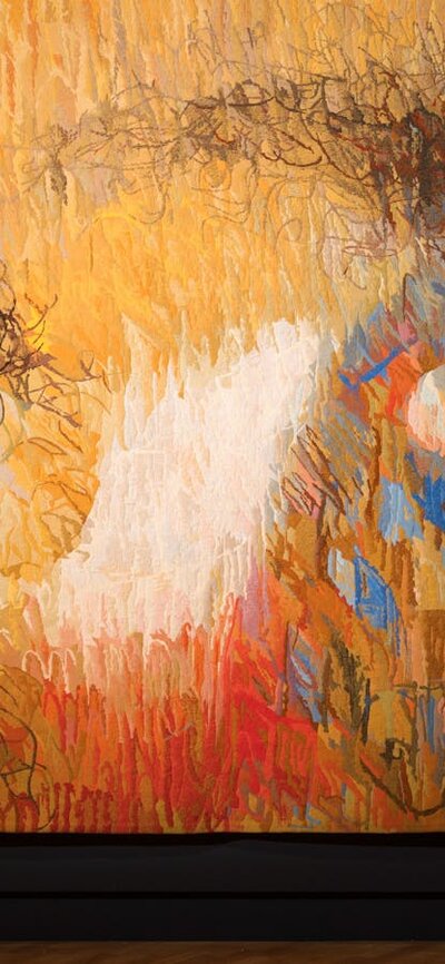 Arthur Boyd, Manufactura de Tapeçarias de Portalegre, St Francis when young turning aside, 1972 View of inside art exhibition with large tapestry and a visitor