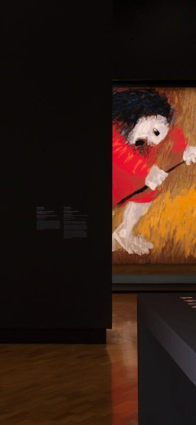 Installation view, Arthur Boyd: Tapestries, National Gallery of Australia, Kamberri/Canberra, 2026 View of inside art exhibition with large tapestry and a visitor