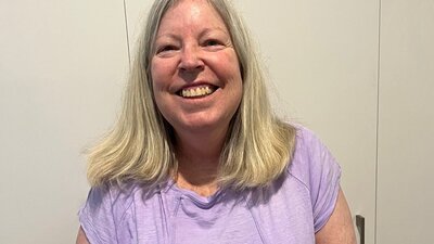 Jennifer Adams, smiling broadly.