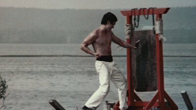 Man in white pants karate punches