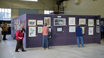Visitors to the 2023 Artists Society of Canberra Spring Exhibition and sale browsing the artworks