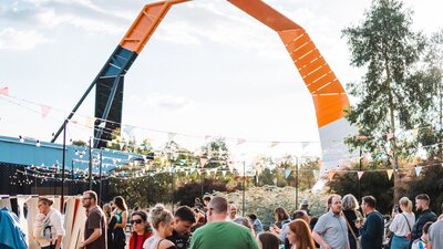 Crowds of people in the Forecourt garden at the National Museum of Australia