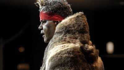 Traditional Gubbi Gubbi dancer performing on stage