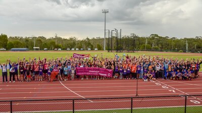 crowd of transplant athletes on athletics track