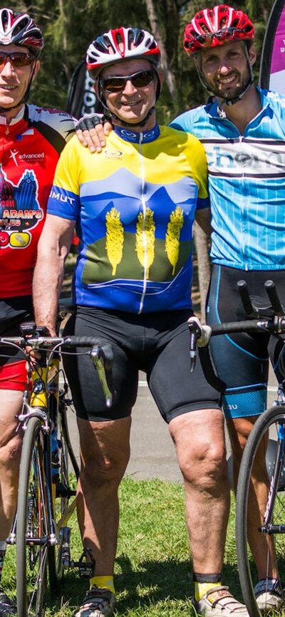 Transplant cyclists standing together with their bikes