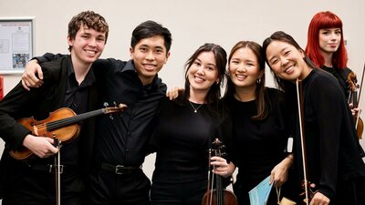 Group of musicians smiling