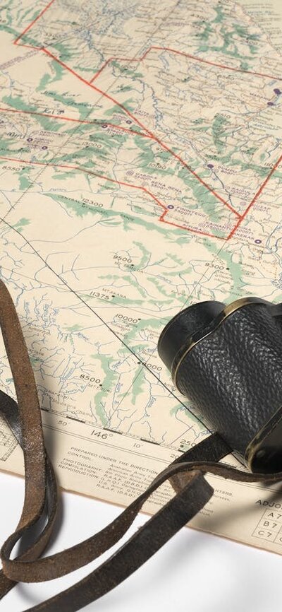 Binoculars and map