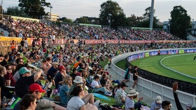 Fans watching the Big Bash on the hill at Manuka Oval