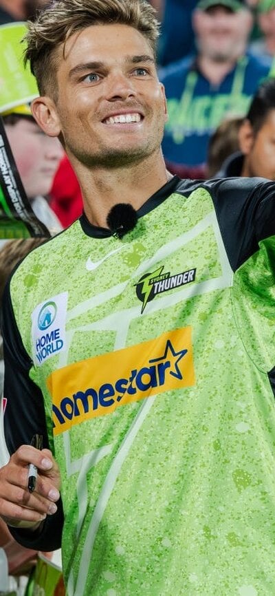 Sydney Thunder star Chris Green takes a selfie with a fan at Manuka Oval