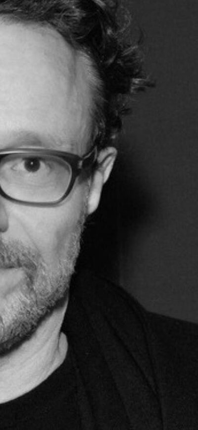 Two black and white images of artist Marco Brambilla