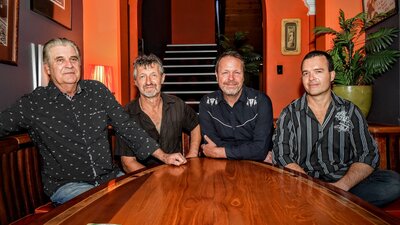 Members of Bondi Cigars sitting at table