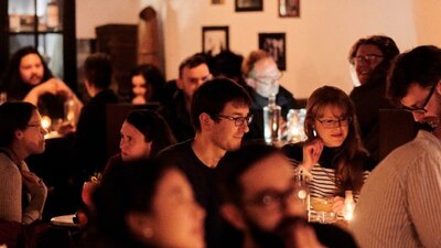 Crowd of people sitting in a bar