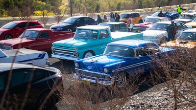 Classic cars parked in lines ready to drive in the Classic Cruise