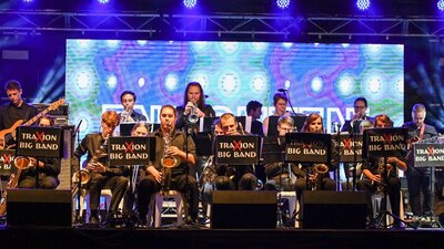 A big band on a lit up stage