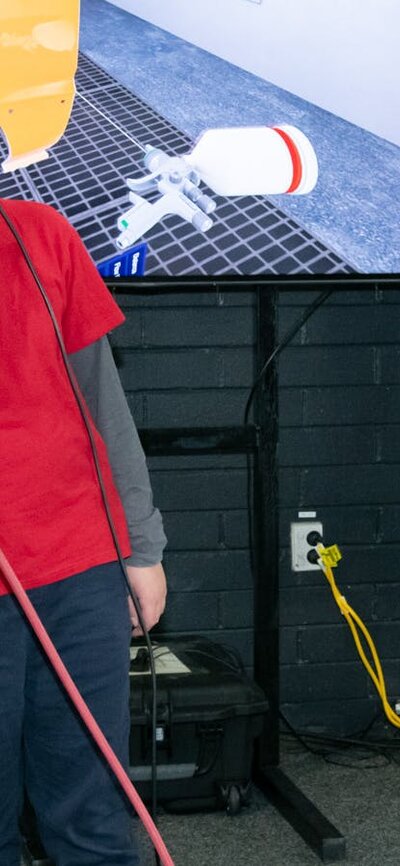 Sikkens virtual welding Student using a virtual welder supplied by Sikkens at the Canberra CareersXpo