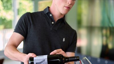 Wines are poured by local winemakers at the Canberra Cellar Door A winemaker serves wine at the Canberra Cellar Door
