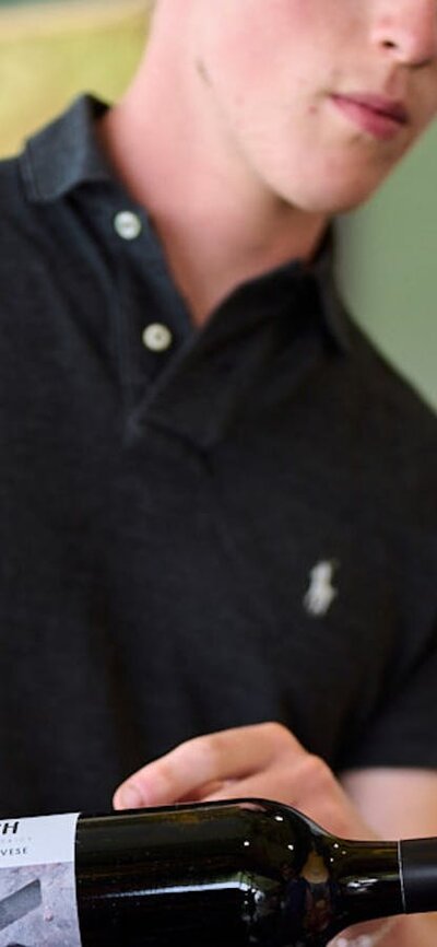 Wines are poured by local winemakers at the Canberra Cellar Door A winemaker serves wine at the Canberra Cellar Door