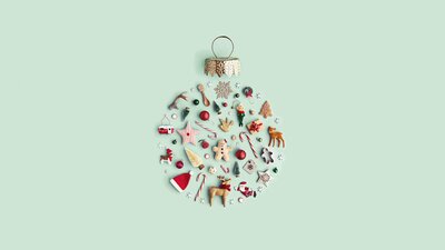 An artwork of Christmas ornaments arranged in the shape of a Christmas bauble