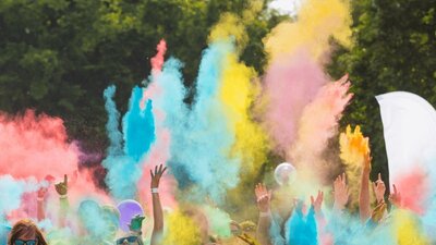 Image of arms waving through the Colour Frenzy fun run