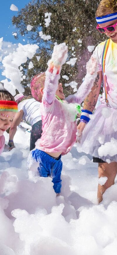 Image of people playing with a foam machine