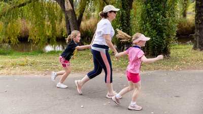 Mother and two kids participating in the fun run