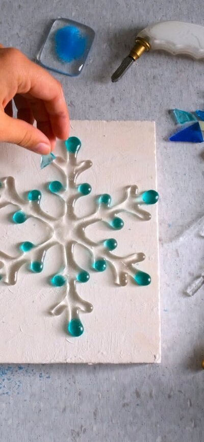 Fire and Ice: Kilnformed Snowflake school holidayprogram Hand arranging glass for kilnformed snow flake