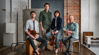 four musicians with their instruments