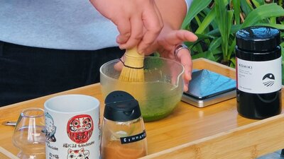 person making matcha person making matcha