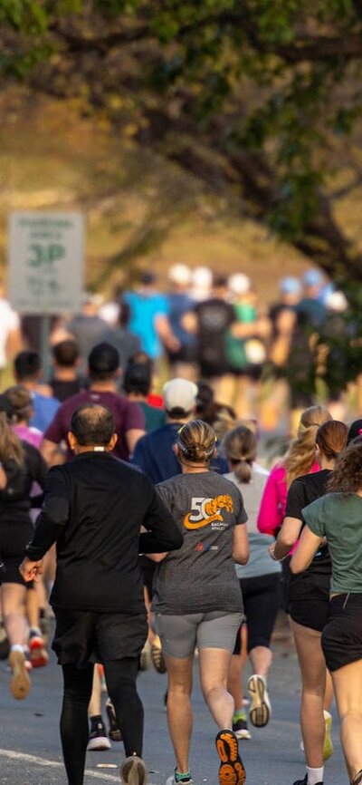 Picture of canberra runners in a big group in the half marathon race