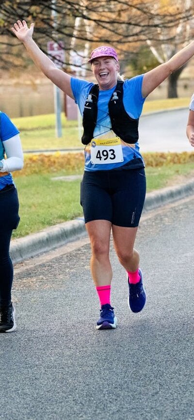 3 female runners enjoying the half marathon event