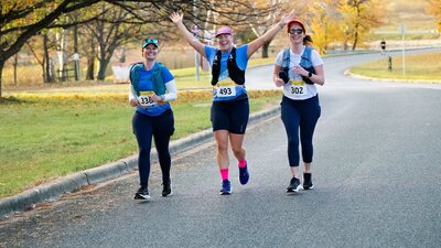 3 female runners enjoying the half marathon event