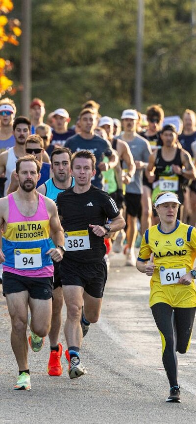 Runners starting the half marathon, running off in a group