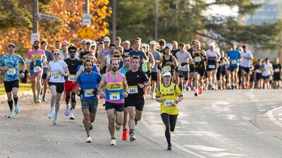 Runners starting the half marathon, running off in a group